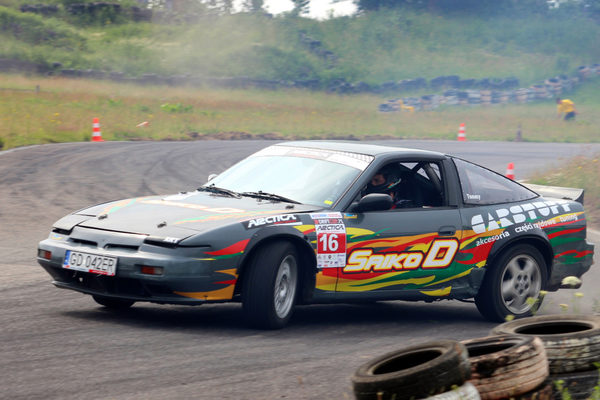 Nissan 200SX in CarStuff livery drifting on the track between the cones